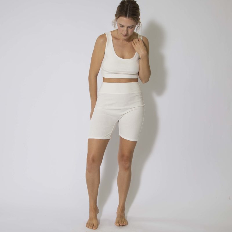 Front view of straight size model wearing Ivory Rib Reversible Scoop Bralette and Biker Shorts.