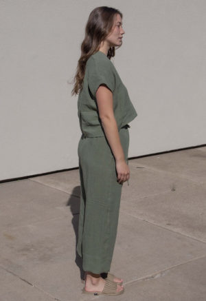 Side view of straight size model wearing Moss Linen Double V Cropped Top.