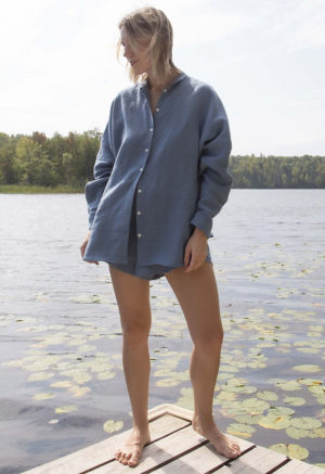 Front view of straight size model wearing Denim Linen Long Sleeve Dolman Button-Up Top.