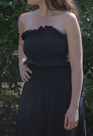 Front view of straight size model wearing Black Linen Ruched Swing Skirt.