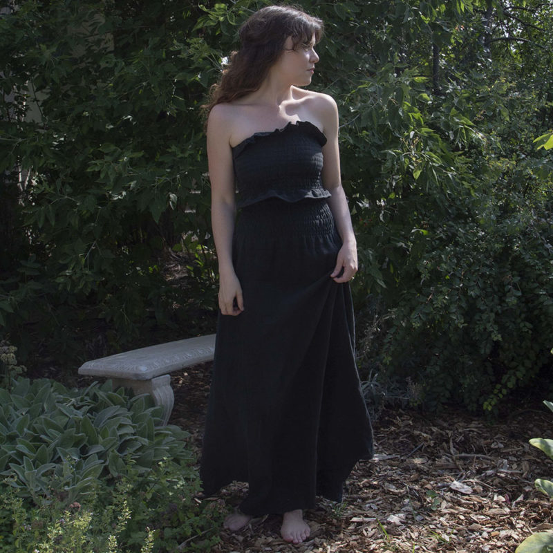 Front view of straight size model wearing Black Linen Ruched Swing Skirt.