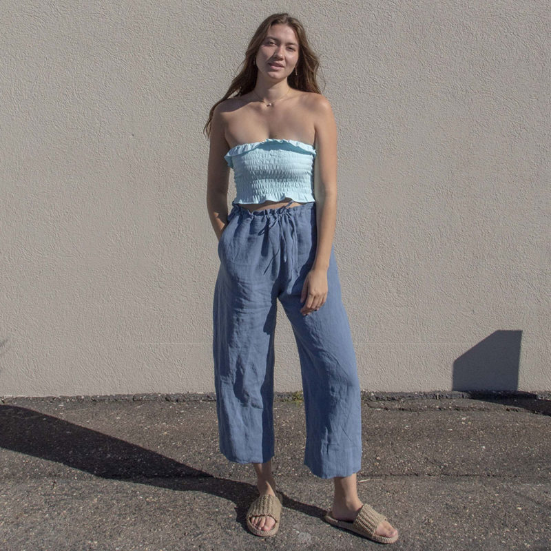 Front view of straight size model wearing Capri Blue Ruffle Tube Top.