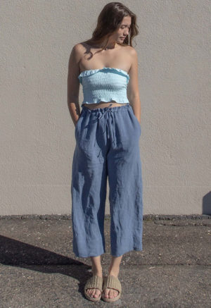 Front view of straight size model wearing Capri Blue Ruffle Tube Top.