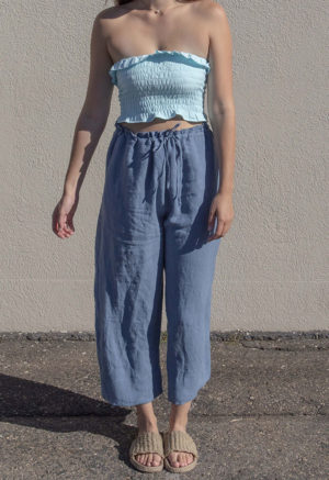 Front view of straight size model wearing Capri Blue Ruffle Tube Top.