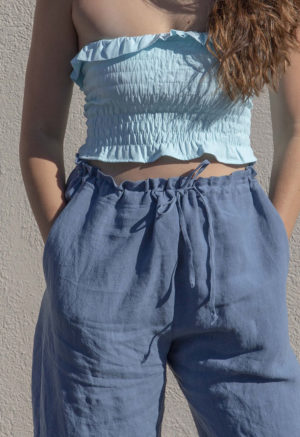 Front view of straight size model wearing Capri Blue Ruffle Tube Top.