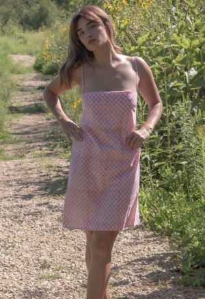 Front view of straight size model wearing Pink & White Leaves Straightaway Knee Length Slip Dress.