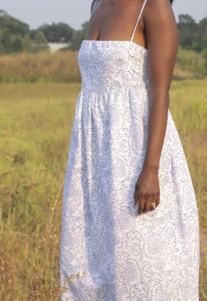 Front/side view of straight size model wearing White & Blue Floral Straightaway Midi Dress.