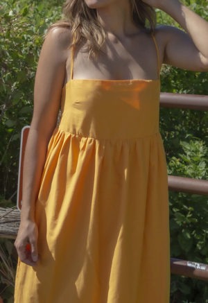 Front view of straight size model wearing Gold Straightaway Midi Dress.