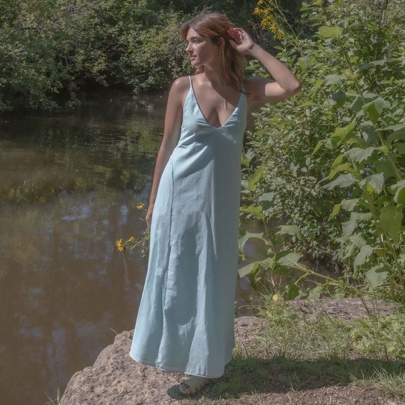 Front view of straight size model wearing Capri Blue V-Neck Maxi Slip Dress.