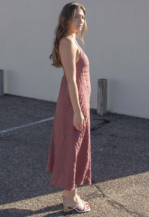 Side view of straight size model wearing Blush Check V-Neck Maxi Slip Dress.