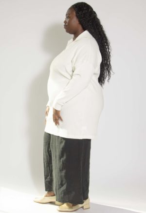 Side view of plus size model wearing Ivory Collar Rib Tunic/Dress.