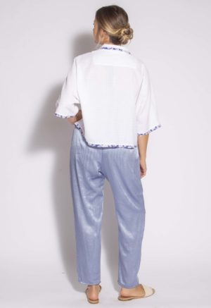 Back view of straight size model wearing White Seersucker Cropped Dolman Sleeve Button-Up.