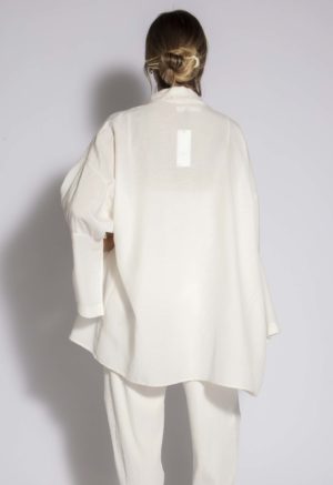 Back view of straight size model wearing Ivory Open Shawl Collar Jacket.