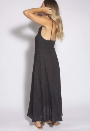 Side view of straight size model wearing Black Check Spaghetti Strap Maxi Dress.