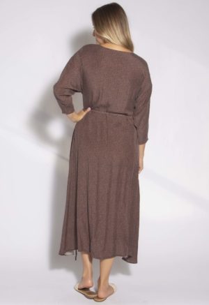 Back view of straight size model wearing Brown with Black Spots Wrap Dress.