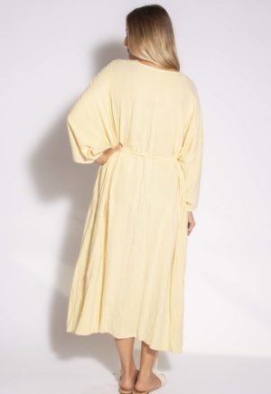 Back view of straight size model wearing Italian Straw Long-Sleeve Wrap Dress.