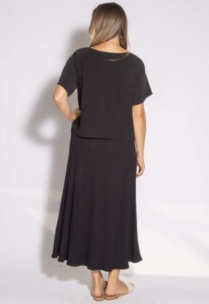 Back view of straight size model wearing Black Rib A-Line Midi Skirt.