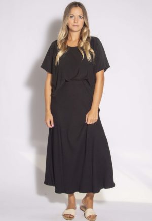 Front view of straight size model wearing Black Rib A-Line Midi Skirt.