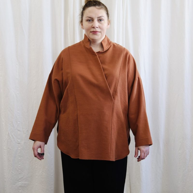 Front view of plus size model wearing Gingerbread Artist Top.