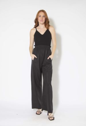 Front view of straight size model wearing Black Lyocell Paper Bag Trousers.
