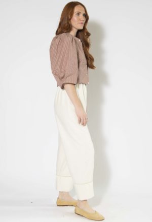 Side view of straight size model wearing Burgundy and Tan Stripe Puff Sleeve Cropped Top.