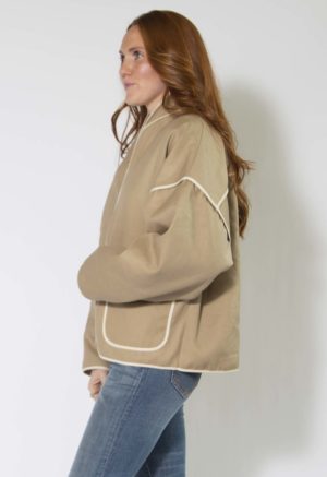 Side view of straight size model wearing Nomad Hemp Round Collar Jacket.