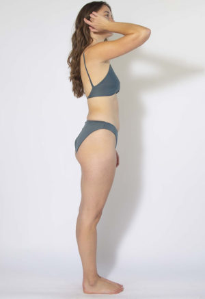 Side view of straight size model wearing Storm High Rise Bikini Bottoms.