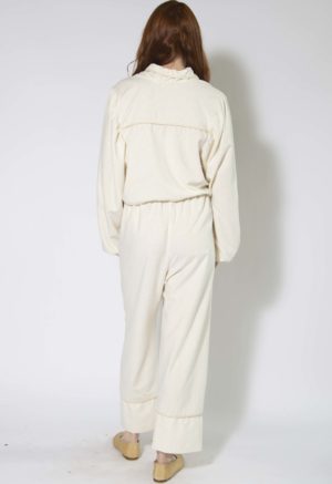 Back view of straight size model wearing Cream Silk Tie Front Blouse and Cuff Pant.