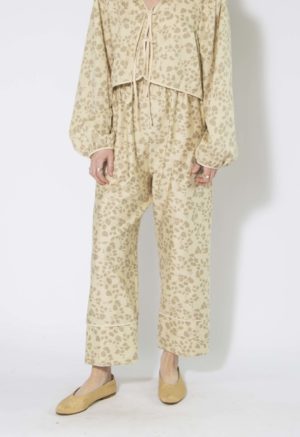 Front view of straight size model wearing Almond Floral Tie Front Blouse and Cuff Pant.