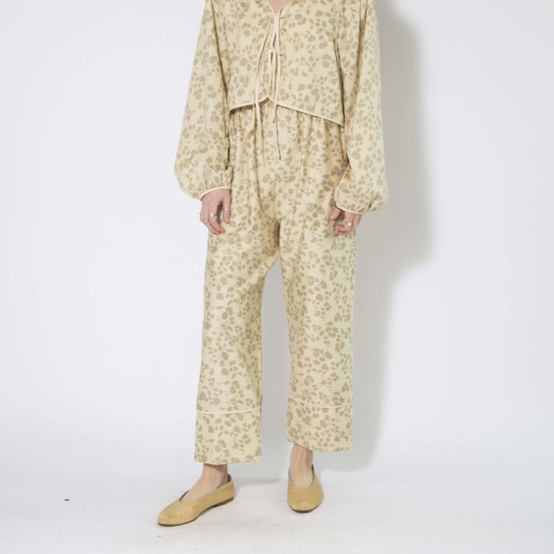 Front view of straight size model wearing Almond Floral Tie Front Blouse and Cuff Pant.