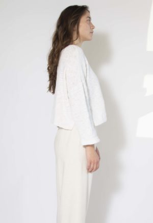 Side view of straight size model wearing White Slub Knit Sweater.