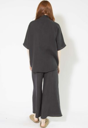 Back view of straight size model wearing Black Linen Dolman Sleeve Button-Up.
