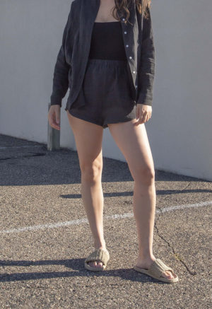 Front view of straight size model wearing Black Linen Short Shorts.