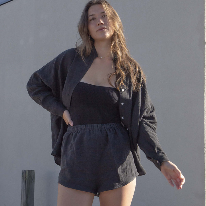 Front view of straight size model wearing Black Linen Short Shorts.