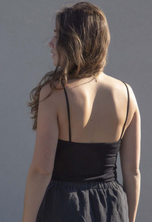 Back view of straight size model wearing Black Linen Short Shorts.