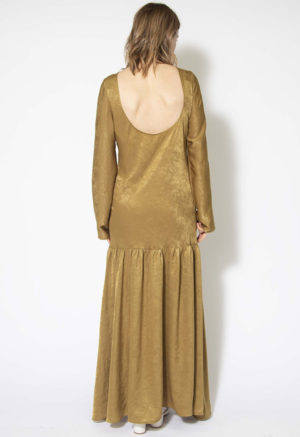Back view of straight size model wearing Gold Dust Drop Waist Maxi Dress.