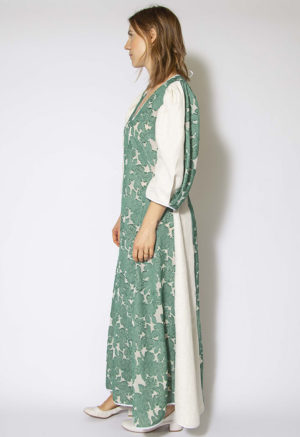 Side view of straight size model wearing Green and White Textured Floral Tie-Back Balloon Sleeve Maxi Dress.