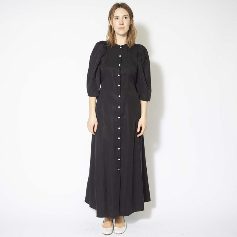 Front view of straight size model wearing Black Lyocell Button Down Dress.