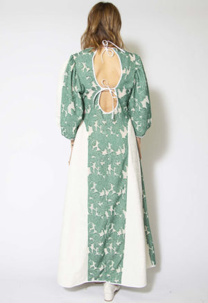 Back view of straight size model wearing Green and White Textured Floral Tie-Back Balloon Sleeve Maxi Dress.