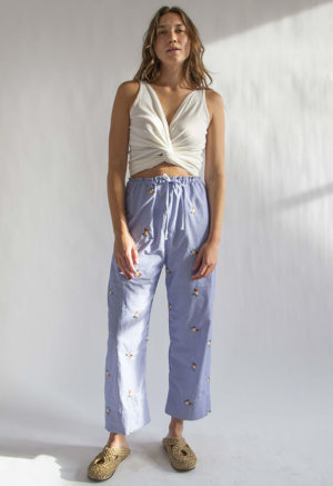 Front view of straight size model wearing Embroidered Blue Stripe Limited Run Drawstring Wide-Leg Pant.