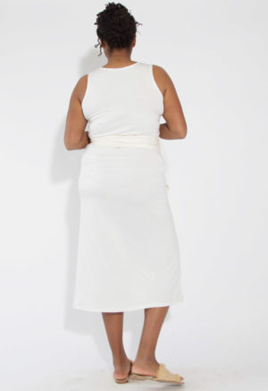 Back view of straight size model wearing White Sleeveless Wrap Dress.
