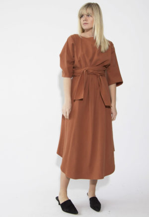 Front view of straight size model wearing Gingerbread Midi Reversible Wrap Dress.