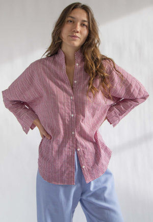 Front view of straight size model wearing Burgundy Gingham Limited Edition Long Sleeve Dolman Button-Up Top.