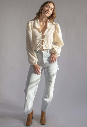 Front view of straight size model wearing Cream Eyelet Limited Edition Beverly Top.