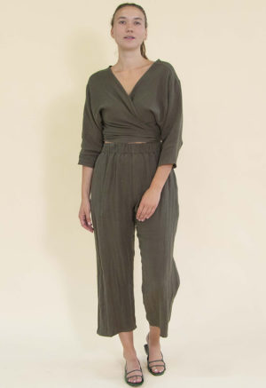 model in dark green wrap top and matching pants