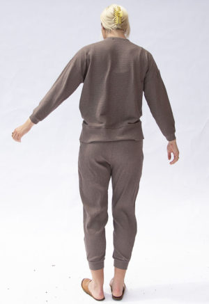 Back view of straight size model wearing Mauve Rib Jogger Pant.