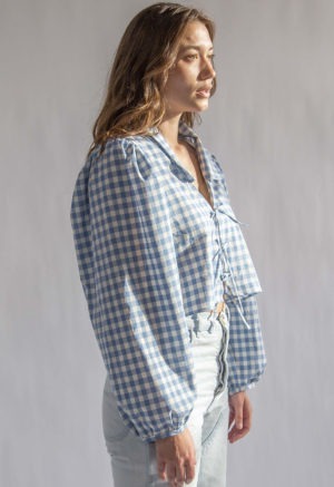 Side view of straight size model wearing Blue & Cream Gingham Limited Edition Juliette Top.