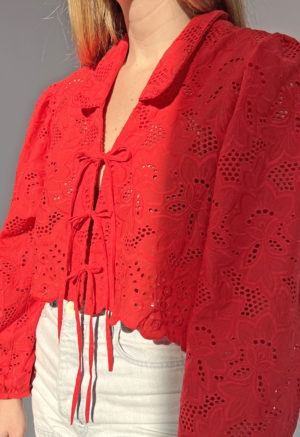 Front/side view of straight size model wearing Red Eyelet Limited Edition Ramona Top.