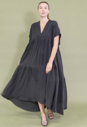 woman in black v-neck maxi length tiered dress