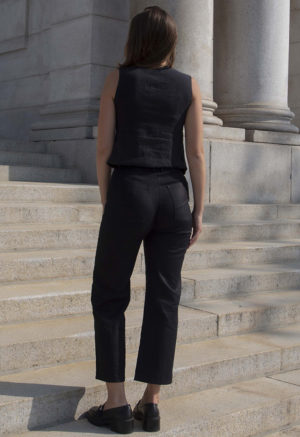 woman in black sleeveless tank vest and black pants